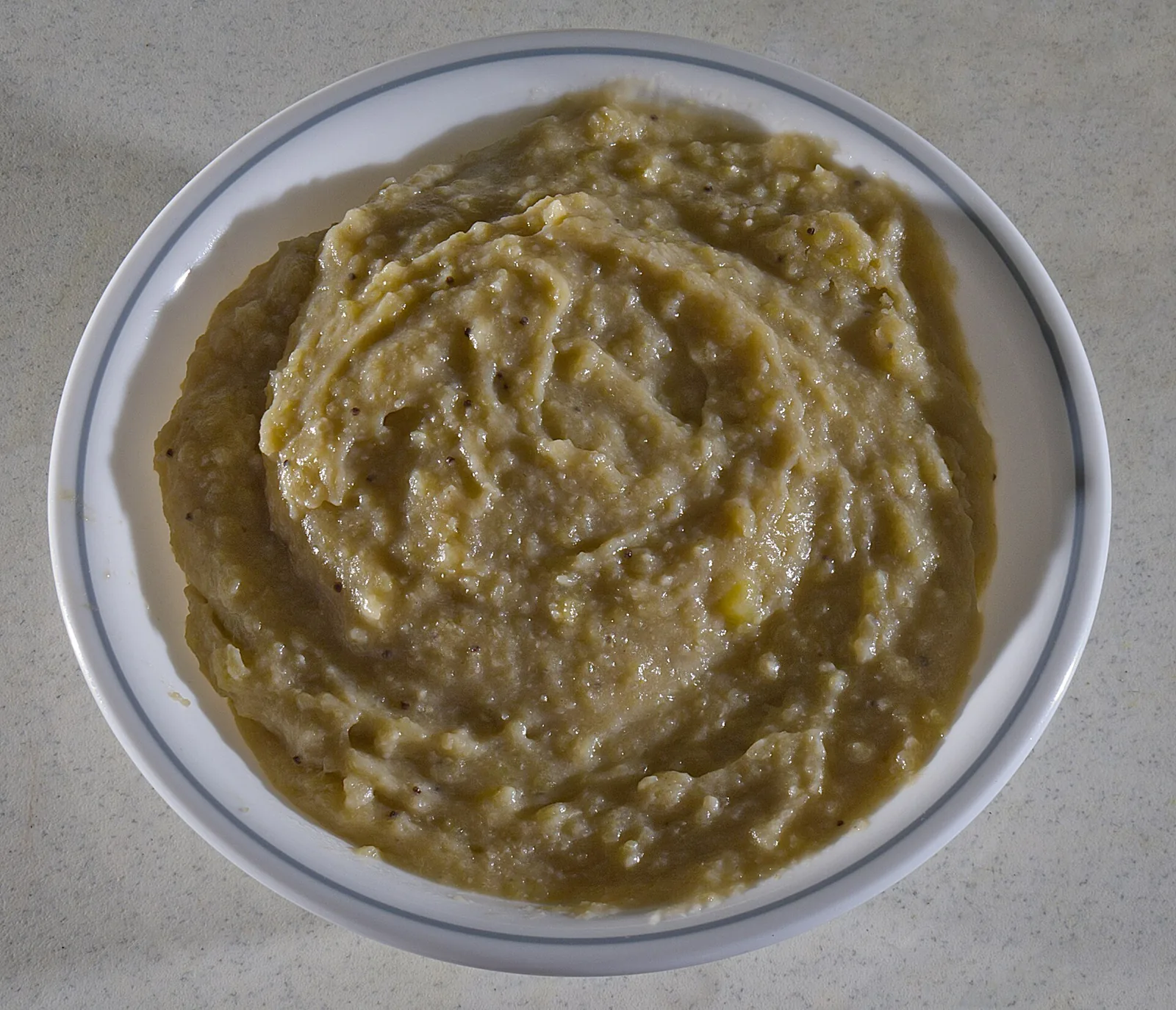 A plate of mangú, mashed green plantains, a Dominican breakfast